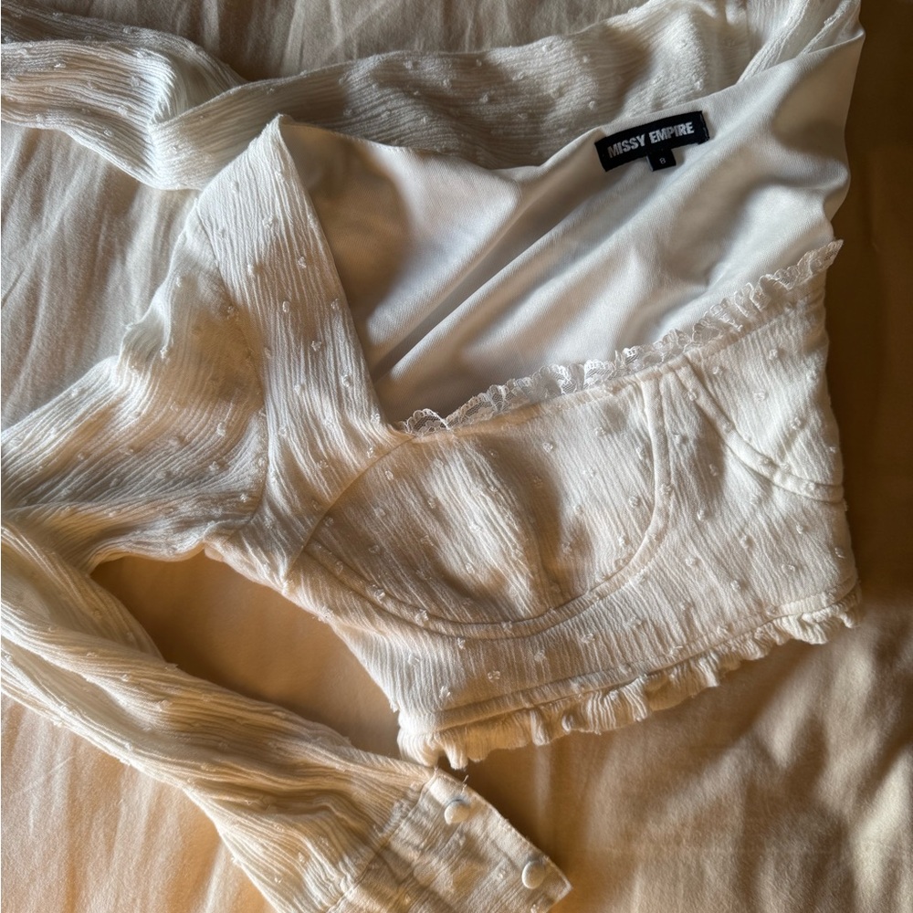 Elegant White Wrap Blouse with Ruffled Long Sleeves